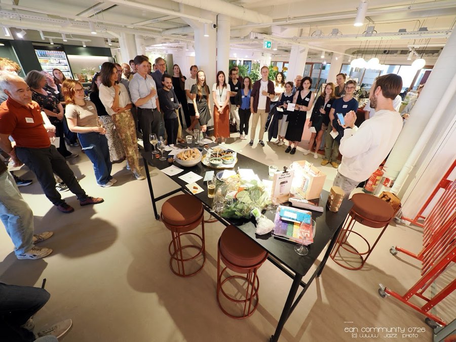 A crowd of people at the EAN office party